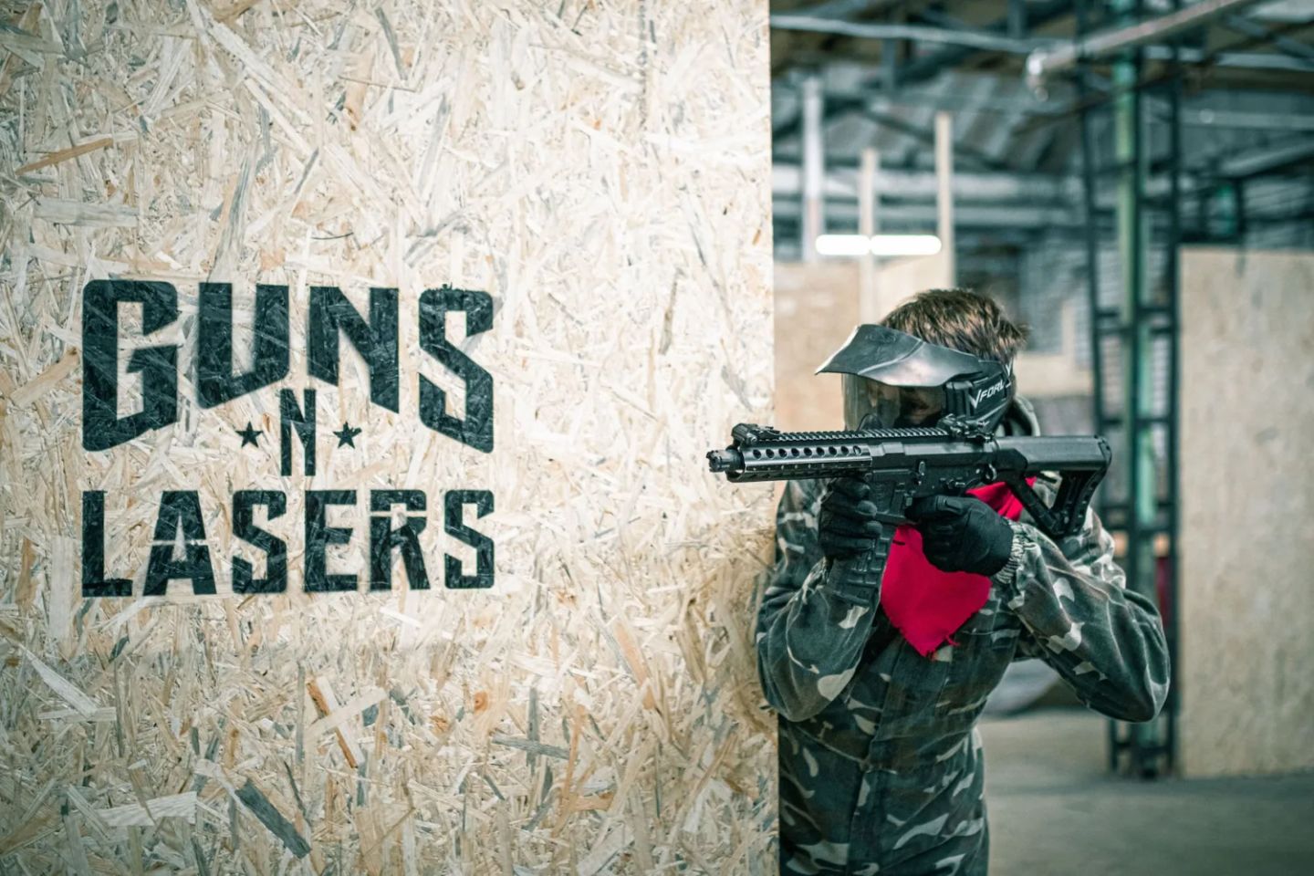 An airsoft player behind cover