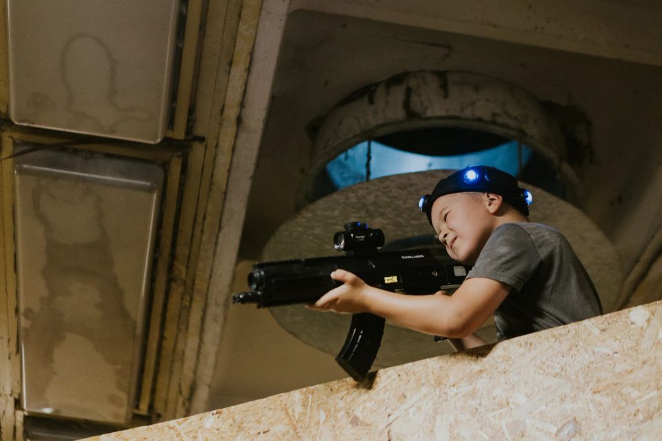 children playing laser tag during a school trip
