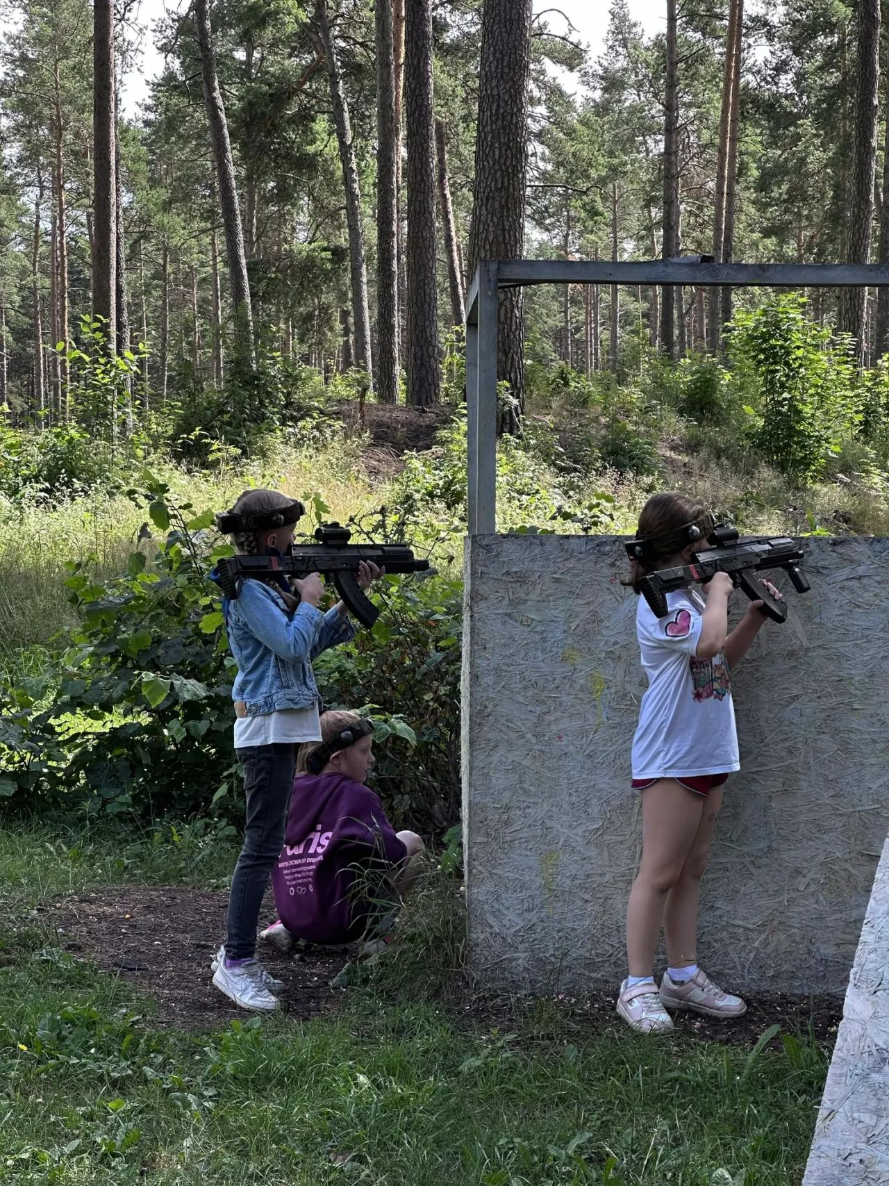 children celebrating a party with laser tag
