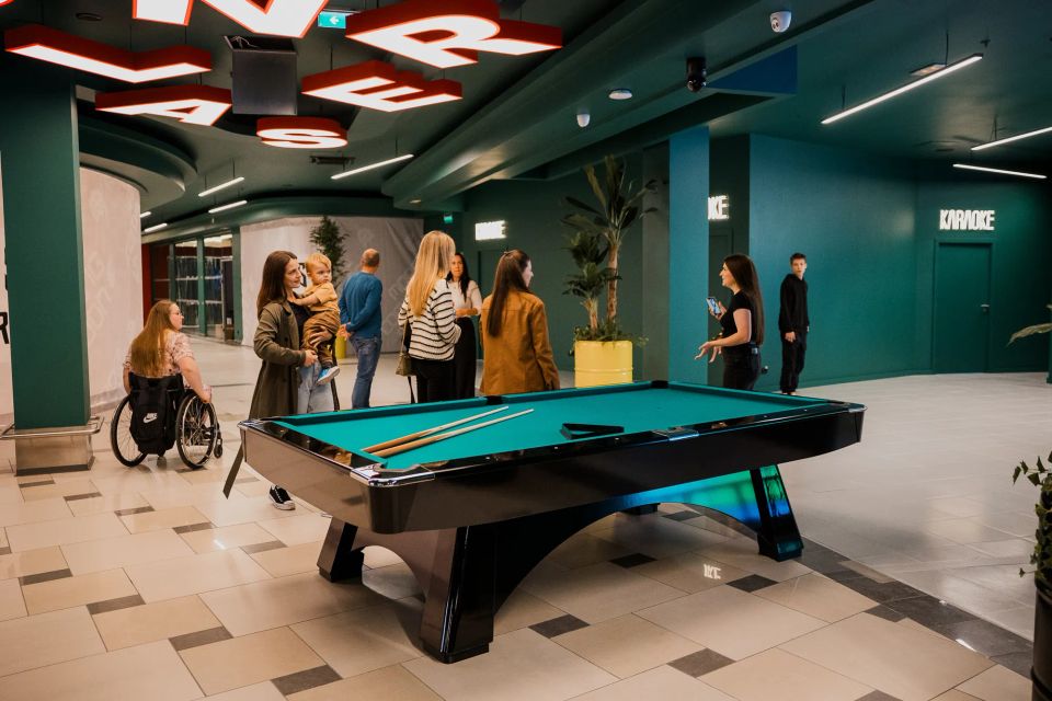 friends playing billiards