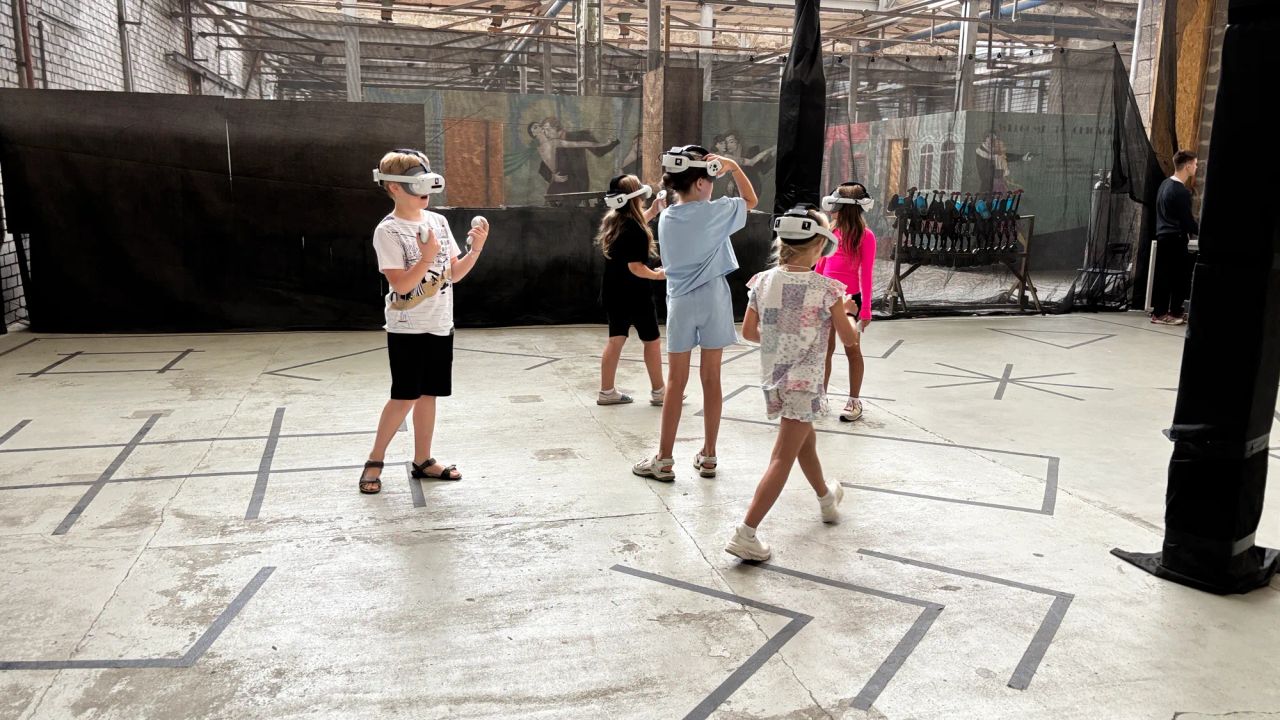 school students playing virtual reality