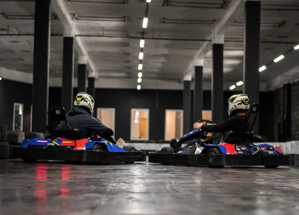 friends racing on an electric go-kart track