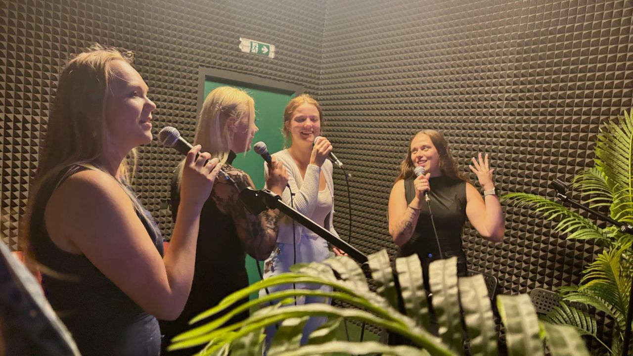 friends singing karaoke