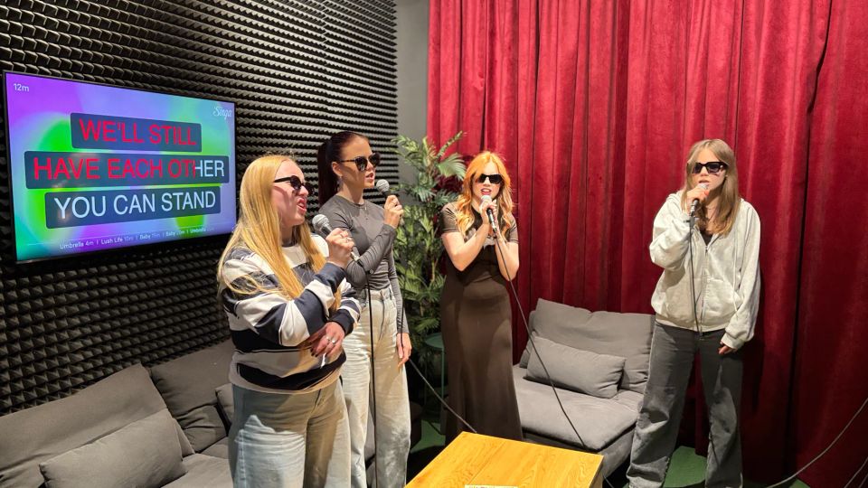 friends singing karaoke at a GUNSnLASERS entertainment park
