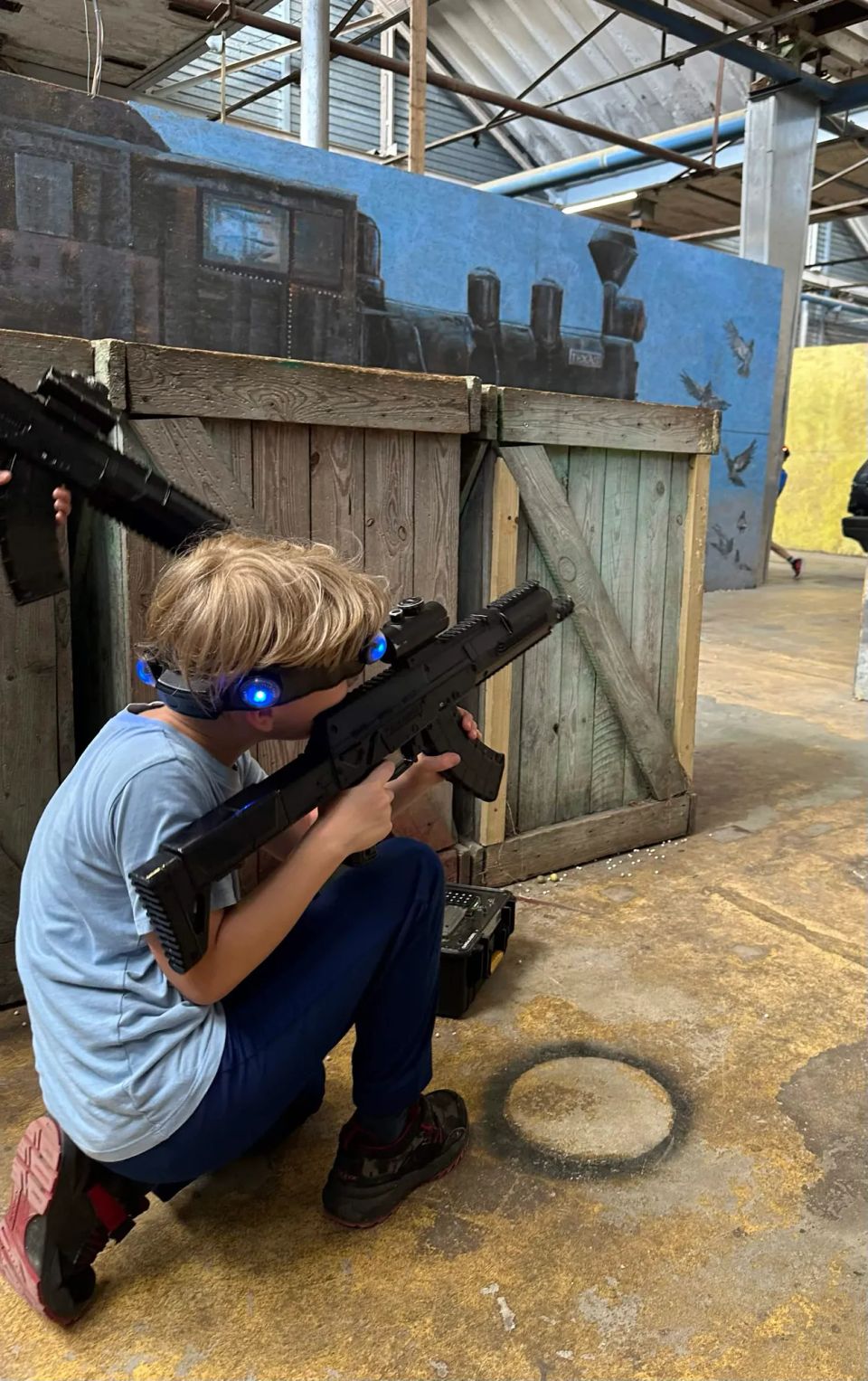 children playing laser tag on a school trip
